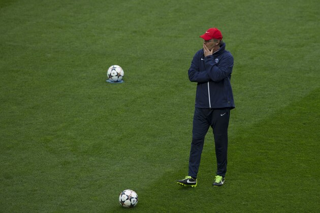 Paris Saint-Germain's manager Laurent Blanc supervises a training session at Chelsea's Stamford Bridge stadium in London, Monday, April 7, 2014.  Paris Saint-Germain take a 3-1 lead from the first leg into their second leg Champions League quarterfinal soccer match against Chelsea on Tuesday.  (AP Photo/Matt Dunham)