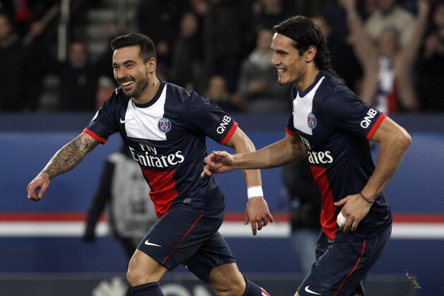 Paris Saint Germain's Ezequiel Lavezzi, left, celebrates with teammate Edinson Cavani, after scoring during their French League one soccer match against Sochaux, at the Parc des Princes stadium, in Paris, Saturday, Dec. 7, 2013. (AP Photo/Thibault Camus)