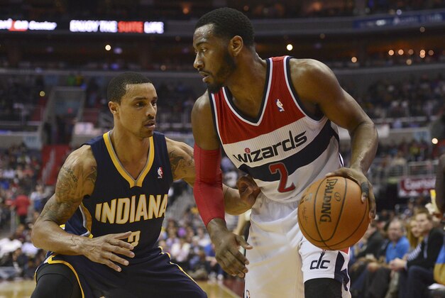 Mar 28, 2014; Washington, DC, USA; Washington Wizards guard John Wall (2) dribbles a Indiana Pacers guard George Hill (3) defends during the third quarter at Verizon Center. Washington Wizards defeated the Indiana Pacers 91-78. Mandatory Credit: Tommy Gilligan-USA TODAY Sports Mar 28, 2014; Washington, DC, USA; Washington Wizards guard John Wall (2) dribbles a Indiana Pacers guard George Hill (3) defends during the third quarter at Verizon Center. Washington Wizards defeated the Indiana Pacers 91-78. Mandatory Credit: Tommy Gilligan-USA TODAY Sports