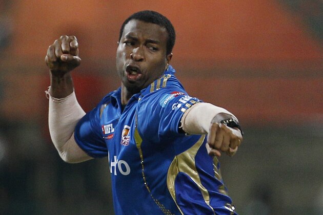 Mumbai Indians' bowler Kieron Pollard celebrates the dismissal of Chennai Super Kings' batsman Subramanium Badrinath, not seen, during their Indian Premier League (IPL) playoff cricket match in Bangalore, India, Wednesday, May 23, 2012. (AP Photo/Aijaz Rahi)