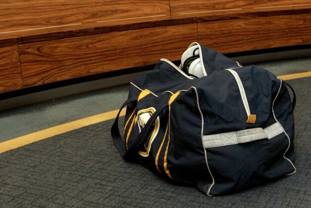 The bag of Buffalo Sabres center Cody Hodgson is seen in the locker room after the NHL hockey team gathered for the last time on Monday, April 14, 2014, in Buffalo, N.Y. (AP Photo/Nick LoVerde)