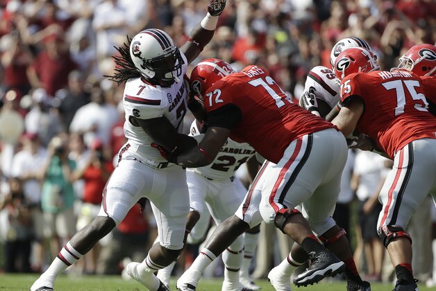 South Carolina defensive end Jadeveon Clowney (7) works against Georgia offensive tackle Kenarious Gates (72) during the first half of an NCAA football game, Saturday, Sept. 7, 2013, in Athens, Ga. (AP Photo/John Bazemore)