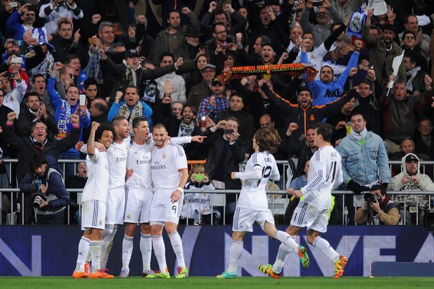 MADRID, SPAIN - MARCH 23:  Cristiano Ronaldo (3rdL) of Real Madrid celebrates his team's third goal with team mates during the La Liga match between Real Madrid CF and FC Barcelona at the Bernabeu on March 23, 2014 in Madrid, Spain.  (Photo by Denis Doyle/Getty Images)