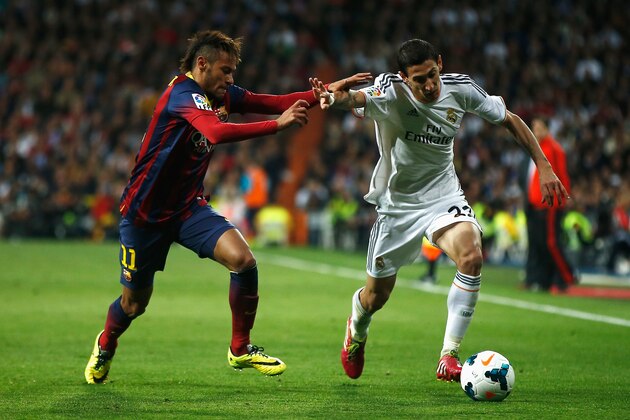 MADRID, SPAIN - MARCH 23:  Angel Di Maria of Real Madrid is challenged by Neymar of Barcelona during the La Liga match between Real Madrid CF and FC Barcelona at the Bernabeu on March 23, 2014 in Madrid, Spain.  (Photo by Gonzalo Arroyo Moreno/Getty Images)