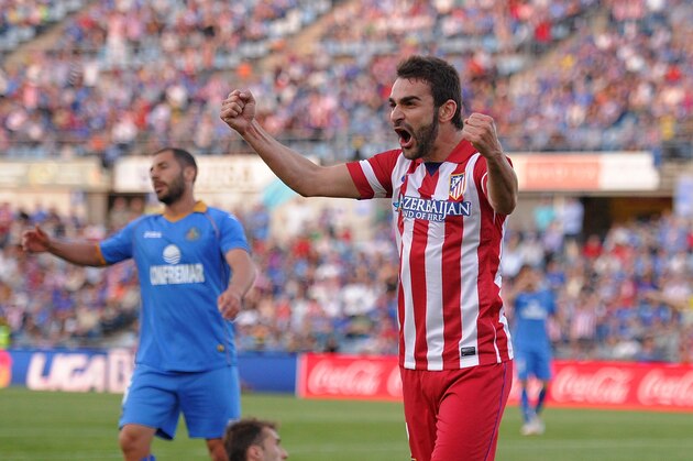 GETAFE, SPAIN - APRIL 13:  Adrian Lopez of Club Atletico de Madrid reacts after teammate Diego Costa scored Atletico's 2nd goal during the La Liga match between Getafe CF and Club Atletico de Madrid at Coliseum Alfonso Perez stadium on April 13, 2014 in Getafe, Spain. Costa was carried off injured after banging his knee off the goalposts while scoring Atletico's 2nd goal.  (Photo by Denis Doyle/Getty Images)