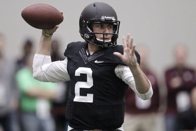 Texas A&M quarterback Johnny Manziel passes the ball during a drill at pro day for NFL football representatives in College Station, Texas, Thursday, March 27, 2014. (AP Photo/Patric Schneider)