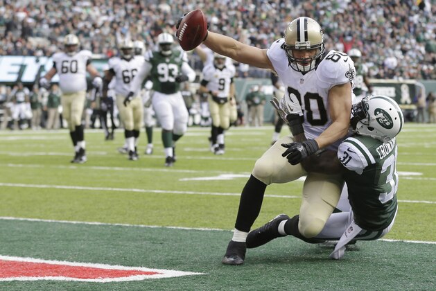 New Orleans Saints' Jimmy Graham (80) is tackled by New York Jets' Antonio Cromartie (31) in the end zone during the first half of an NFL football game Sunday, Nov. 3, 2013, in East Rutherford, N.J.  (AP Photo/Mel Evans)