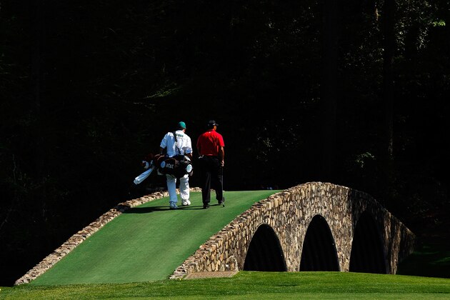 AUGUSTA, GA - APRIL 12:  Tiger Woods and his caddie Steve Williams cross Hogan's Bridge during the final round of the 2009 Masters Tournament at Augusta National Golf Club on April 12, 2009 in Augusta, Georgia.  (Photo by Jamie Squire/Getty Images)