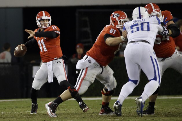 Georgia quarterback Aaron Murray (11) throws from the pocket in the first half of an NCAA college football game against Kentucky, Saturday, Nov. 23, 2013, in Athens, Ga. (AP Photo/John Bazemore)