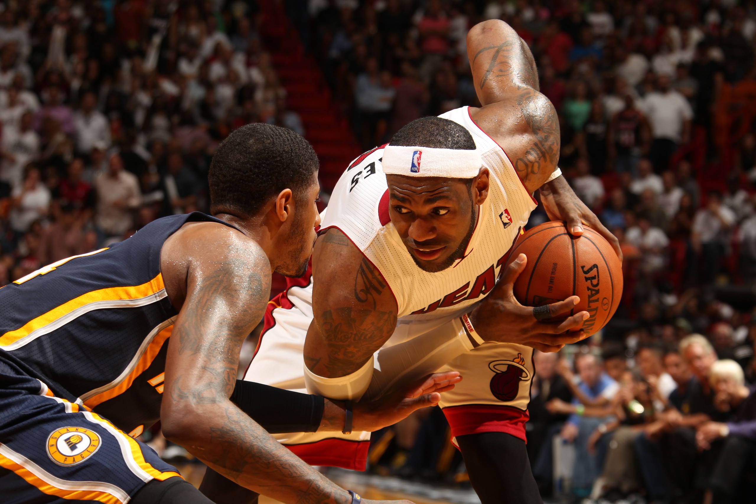 MIAMI, FL - April 11: LeBron James #6 of the Miami Heat handles the ball against the Indiana Pacers at the American Airlines Arena in Miami, Florida on April 11, 2014. NOTE TO USER: User expressly acknowledges and agrees that, by downloading and/or using this photograph, user is consenting to the terms and conditions of the Getty Images License Agreement. Mandatory copyright notice: Copyright NBAE 2014 (Photo by Issac Baldizon/NBAE via Getty Images)