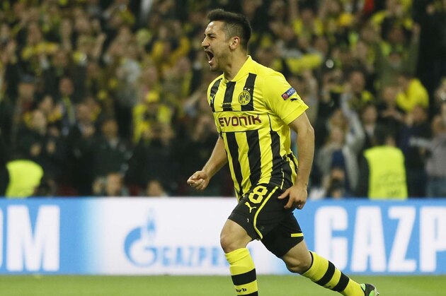Dortmund's Ilkay Guendogan, right, celebrates scoring his side's first goal, during the Champions League Final between  Borussia Dortmund and Bayern Munich at Wembley Stadium in London, Saturday May 25, 2013. (AP Photo/Kirsty Wigglesworth)