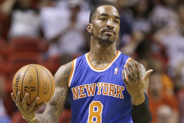 New York Knicks guard J.R. Smith reacts to a call during the first half of an NBA basketball game against the Miami Heat, Sunday, April 6, 2014 in Miami. (AP Photo/Wilfredo Lee)