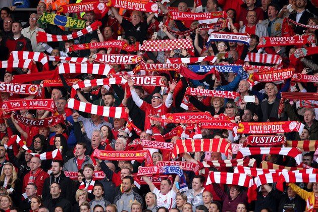 LIVERPOOL, ENGLAND - APRIL 15:  Liverpool fans sing 'You'll Never Walk Alone' during the Hillsborough memorial service marking the 25th anniversary of the Hillsborough Disaster at Anfield stadium on April 15, 2014 in Liverpool, England. Thousands of fans, friends and relatives took part in the service at Liverpool's Anfield stadium to mark the 25th anniversary of the Hillsborough disaster. Bells across the City of Liverpool rung during a one minute silence. A total of 96 Liverpool supporters lost their lives during a crush at an FA Cup semi final against Nottingham Forest at the Hillsborough football ground in Sheffield, South Yorkshire in 1989.  (Photo by Christopher Furlong/Getty Images)