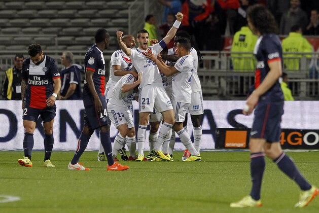 Lyon's Maxime Gonalons celebrates with his teammates after they scored a goal against Paris Saint Germain during their French League One soccer match in Lyon, central France, Sunday, April 13, 2014. (AP Photo/Laurent Cipriani) Lyon's Maxime Gonalons celebrates with his teammates after they scored a goal against Paris Saint Germain during their French League One soccer match in Lyon, central France, Sunday, April 13, 2014. (AP Photo/Laurent Cipriani)