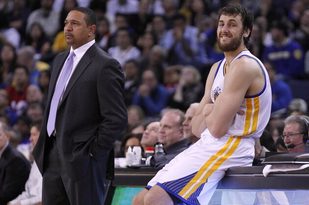 February 2, 2013; Oakland, CA, USA; Golden State Warriors center Andrew Bogut (12) stands next to head coach Mark Jackson before checking into the game in the fourth quarter against the Phoenix Suns at ORACLE Arena. The Warriors won 113-93. Mandatory Credit: Cary Edmondson-USA TODAY Sports
