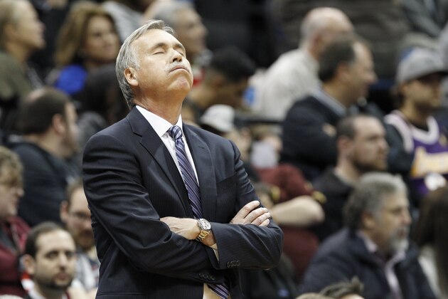 Los Angeles Lakers head coach Mike D'Antoni reacts to a call during the first quarter of an NBA basketball game against the Minnesota Timberwolves in Minneapolis, Friday, March 28, 2014.  (AP Photo/Ann Heisenfelt)