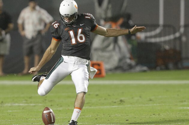 Miami punter Pat O'Donnell kicks during the first half of an NCAA college football game against Virginia Tech, Saturday, Nov. 9, 2013, in Miami Gardens, Fla. (AP Photo/Wilfredo Lee)