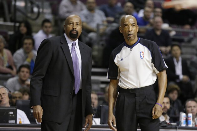 New York Knicks head coach Mike Woodson and referee Leon Wood watch from the sidelines during the second half of an NBA basketball game against the Detroit Pistons in Auburn Hills, Mich., Tuesday, Nov. 19, 2013. (AP Photo/Carlos Osorio)