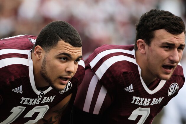 COLLEGE STATION, TX - NOVEMBER 09:  Mike Evans #13 (L) and Johnny Manziel #2 of the Texas A&M Aggies wait on the field before the game against the Mississippi State Bulldogs at Kyle Field on November 9, 2013 in College Station, Texas.  (Photo by Scott Halleran/Getty Images)