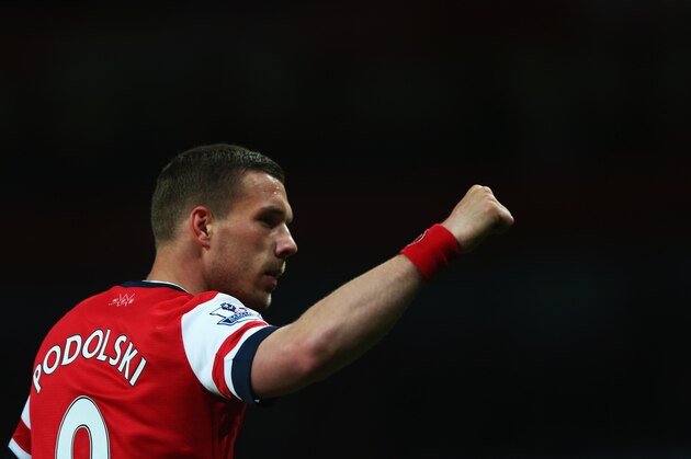 LONDON, ENGLAND - APRIL 15:  Lukas Podolski of Arsenal celebrates as he scores their third goal during the Barclays Premier League match between Arsenal and West Ham United at Emirates Stadium on April 15, 2014 in London, England.  (Photo by Paul Gilham/Getty Images)