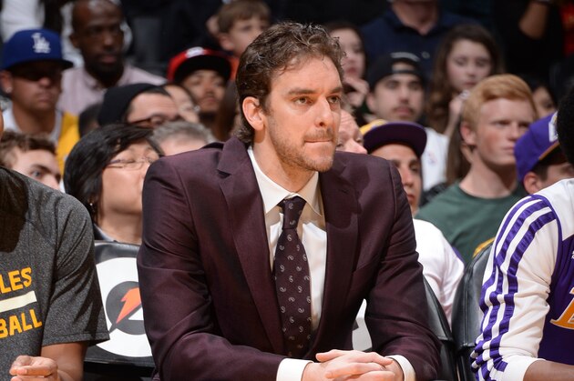 LOS ANGELES, CA - APRIL 13: Pau Gasol #16 of the Los Angeles Lakers looks on from the bench against the Memphis Grizzlies at Staples Center on April 13, 2014 in Los Angeles, California. NOTE TO USER: User expressly acknowledges and agrees that, by downloading and/or using this Photograph, user is consenting to the terms and conditions of the Getty Images License Agreement. Mandatory Copyright Notice: Copyright 2014 NBAE (Photo by Andrew D. Bernstein/NBAE via Getty Images)