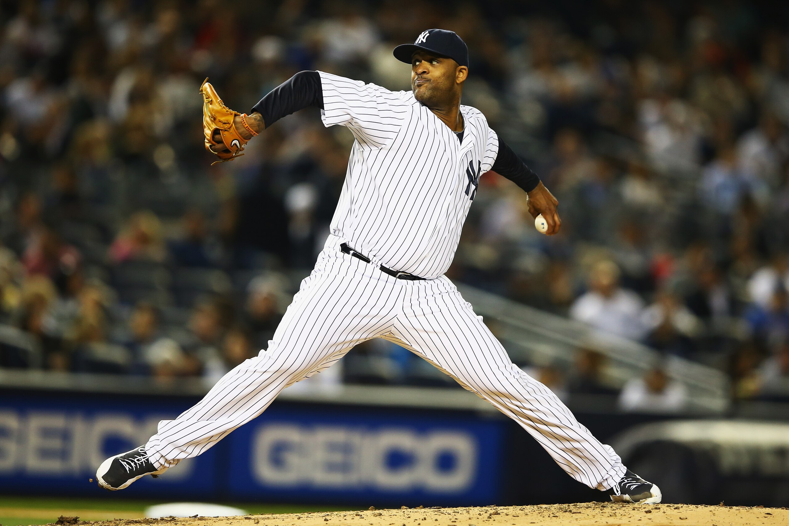 NEW YORK, NY - APRIL 11:  CC Sabathia #52 of the New York Yankees pitches against the Boston Red Sox during their game at Yankee Stadium on April 11, 2014 in the Bronx borough of New York City.  (Photo by Al Bello/Getty Images)