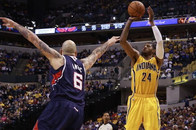 Indiana Pacers forward Paul George (24) shoots the basketball defended by Atlanta Hawks center Pero Antic in the second half of an NBA basketball game in Indianapolis, Sunday, April 6, 2014. Atlanta won 107-88.  (AP Photo/R Brent Smith)