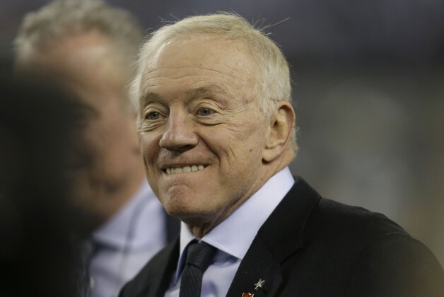 Dallas Cowboys owner Jerry Jones walks the field before an NFL football game against the Philadelphia Eagles Sunday, Dec. 29, 2013, in Arlington, Texas.  (AP Photo/Tim Sharp)