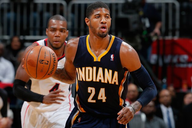 Indiana Pacers small forward Paul George (24) drives against Atlanta Hawks small forward DeMarre Carroll (5) in the first  half of an NBA basketball game, Tuesday, Feb. 4, 2014, in Atlanta. (AP Photo/John Bazemore)