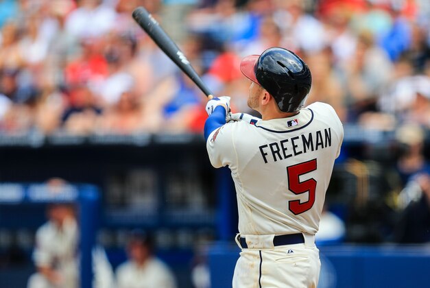 Apr 13, 2014; Atlanta, GA, USA; Atlanta Braves first baseman Freddie Freeman (5) hits a two run home run in the second inning against the Washington Nationals at Turner Field. Mandatory Credit: Daniel Shirey-USA TODAY Sports