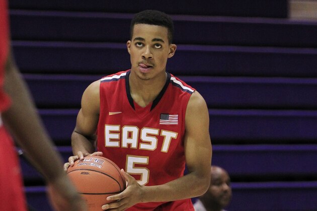 Jul 18, 2013; Washington, DC, USA; Team USA East player Phil Booth (5) holds the ball against Team Canada during the Nike Global Challenge at Trinity University. Mandatory Credit: Geoff Burke-USA TODAY Sports
