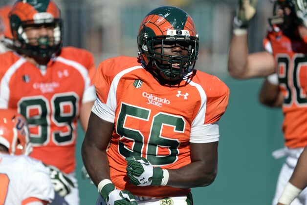 Sep 28, 2013; Fort Collins, CO, USA; Colorado State Rams linebacker Shaquil Barrett (56) reacts after causing a fumble for a safety late in the third quarter against the UTEP Miners at Hughes Stadium. Mandatory Credit: Ron Chenoy-USA TODAY Sports