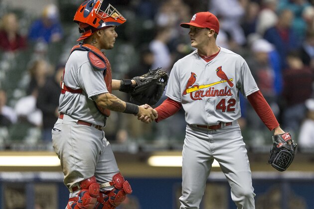 MILWAUKEE, WI - APRIL 15: Yadier Molina, left, and Seth Maness of the St. Louis Cardinals shake hands after they defeat the Milwaukee Brewers in the ninth inning at Miller Park on April 15, 2014 in Milwaukee, Wisconsin.  All uniformed team members are wearing jersey number 42 in honor of Jackie Robinson Day.  (Photo by Tom Lynn/Getty Images)