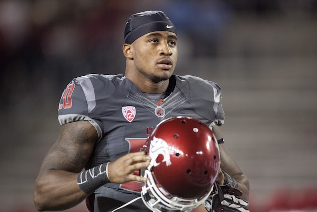 Washington State safety Deone Bucannon (20) looks into the crowd as he enters Martin Stadium before the start of an NCAA college football game against Idaho on Saturday, Sept. 21, 2013, in Pullman, Wash. (AP Photo/Dean Hare)