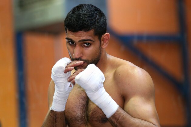 BOLTON, ENGLAND - MARCH 24:  Amir Khan shadow boxes during a media workout at the Gloves Community Centre on March 24, 2014 in Bolton, England.  (Photo by Alex Livesey/Getty Images)