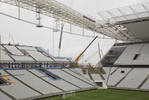 Men work at the still unfinished Itaquerao stadium in Sao Paulo, Brazil, Tuesday, April 15, 2014. The stadium that will host the World Cup opener match between Brazil and Croatia on June 12, will hold nearly 70,000 people in the opener, but after the World Cup its capacity will be reduced to about 45,000. (AP Photo/Andre Penner) Men work at the still unfinished Itaquerao stadium in Sao Paulo, Brazil, Tuesday, April 15, 2014. The stadium that will host the World Cup opener match between Brazil and Croatia on June 12, will hold nearly 70,000 people in the opener, but after the World Cup its capacity will be reduced to about 45,000. (AP Photo/Andre Penner)