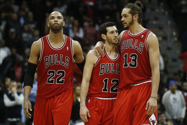 Chicago Bulls from left: Chicago Bulls power forward Taj Gibson (22), Chicago Bulls shooting guard Kirk Hinrich (12) ans Chicago Bulls center Joakim Noah (13) in the second half of an NBA basketball game  Tuesday, Feb. 25, 2014, in Atlanta. Chicago won 107-103. (AP Photo/John Bazemore)