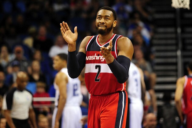 Apr 11, 2014; Orlando, FL, USA; Washington Wizards guard John Wall (2) celebrates a call in the fourth quarter as the Wizards beat the Orlando Magic 96-86 at Amway Center. Mandatory Credit: David Manning-USA TODAY Sports
