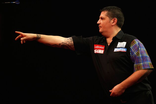 LONDON, ENGLAND - DECEMBER 28: Gary Anderson of Scotland in action during his third round match against Michael van Gerwen of Holland on day thirteen of the Ladbrokes.com World Darts Championship at Alexandra Palace on December 28, 2013 in London, England.  (Photo by Harry Engels/Getty Images)