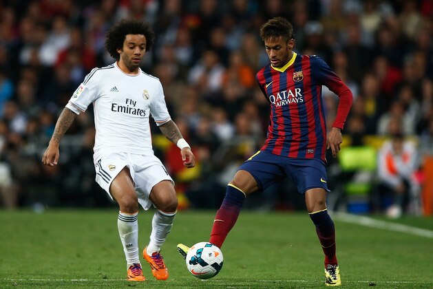 MADRID, SPAIN - MARCH 23: Neymar of Barcelona is closed down by Marcelo of Real Madrid during the La Liga match between Real Madrid CF and FC Barcelona at the Bernabeu on March 23, 2014 in Madrid, Spain.  (Photo by Gonzalo Arroyo Moreno/Getty Images)