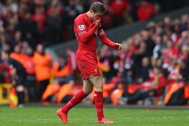 LIVERPOOL, ENGLAND - APRIL 13:  Jordan Henderson of Liverpool walks off after being shown a red card by Referee Mark Clattenburg during the Barclays Premier League match between Liverpool and Manchester City at Anfield on April 13, 2014 in Liverpool, England.  (Photo by Alex Livesey/Getty Images)