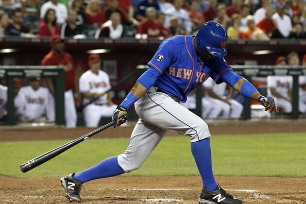 New York Mets' Curtis Granderson strikes out during the third inning of a baseball game against the Arizona Diamondbacks on Monday, April 14, 2014, in Phoenix. (AP Photo/Ross D. Franklin)
