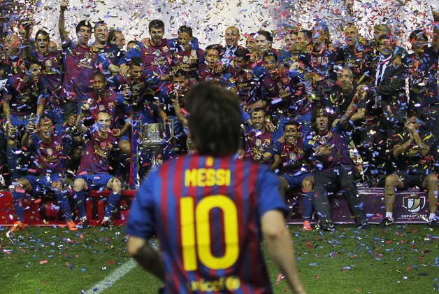 FILE - In this May 25, 2012 file photo, FC Barcelona's Lionel Messi from Argentina, front celebrates with his team mates after the final Copa del Rey soccer match against Athletic Bilbao at the Vicente Calderon stadium in Madrid, Spain. (AP Photo/Andres Kudacki, File) FILE - In this May 25, 2012 file photo, FC Barcelona's Lionel Messi from Argentina, front celebrates with his team mates after the final Copa del Rey soccer match against Athletic Bilbao at the Vicente Calderon stadium in Madrid, Spain. (AP Photo/Andres Kudacki, File)