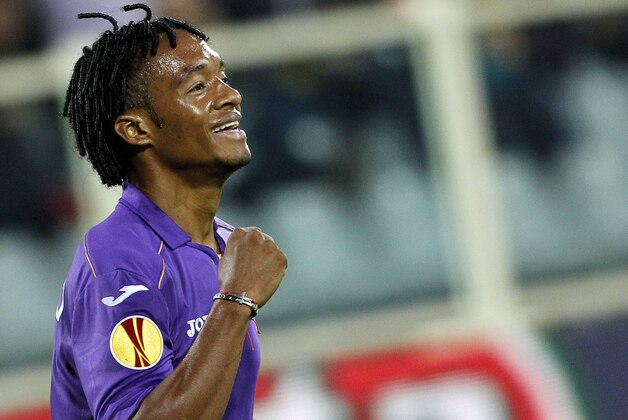 Fiorentina's Juan Guillermo Cuadrado, of Colombia, celebrates after scoring during an Europa League, group E match, between Fiorentina and Pandurii, at the Artemio Franchi stadium in Florence, Italy, Thursday, Oct.  24, 2013. (AP Photo/Fabrizio Giovannozzi)