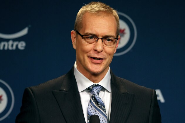 WINNIPEG, MB - JANUARY 13: Head Coach Paul Maurice of the Winnipeg Jets smiles as he answers questions during the post-game press conference following a 5-1 victory over the Phoenix Coyotes at the MTS Centre on January 13, 2014 in Winnipeg, Manitoba, Canada. The victory marked Maurice's first win as head coach of the Jets after replacing Claude Noel. (Photo by Jonathan Kozub/NHLI via Getty Images)