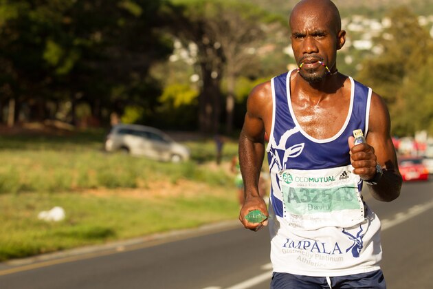 CAPE TOWN, SOUTH AFRICA - MARCH 30:  David Gatebe, race winner, competes during the Old Mutual Two Oceans Ultra Marathon on March 30, 2013 in Cape Town, South Africa.  (Photo by Gallo Images/Getty Images)