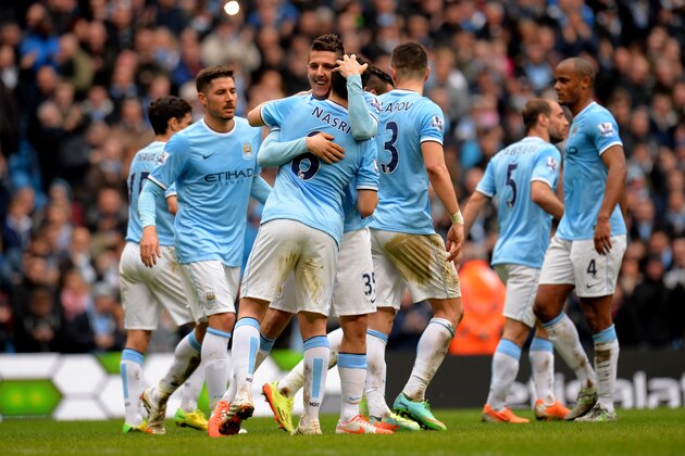 MANCHESTER, ENGLAND - APRIL 05:  Stevan Jovetic of Manchester City is congratulated by teammate Sami Nasri  after scoring his team's fourth goal during the Barclays Premier League match between Manchester City and Southampton at Etihad Stadium on April 5, 2014 in Manchester, England.  (Photo by Shaun Botterill/Getty Images)