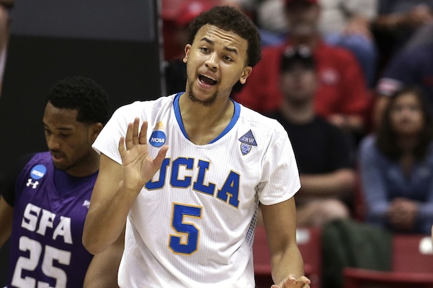 UCLA's Kyle Anderson urges on his team during the second half of a third-round game against Stephen F. Austin in the NCAA college basketball tournament, Sunday, March 23, 2014, in San Diego. (AP Photo/Gregory Bull)
