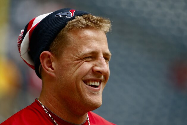 HOUSTON, TX - DECEMBER 01:  J.J. Watt #99 of Houston Texans works out on the field before the game against the New England Patriots at Reliant Stadium on December 1, 2013 in Houston, Texas.  (Photo by Scott Halleran/Getty Images)