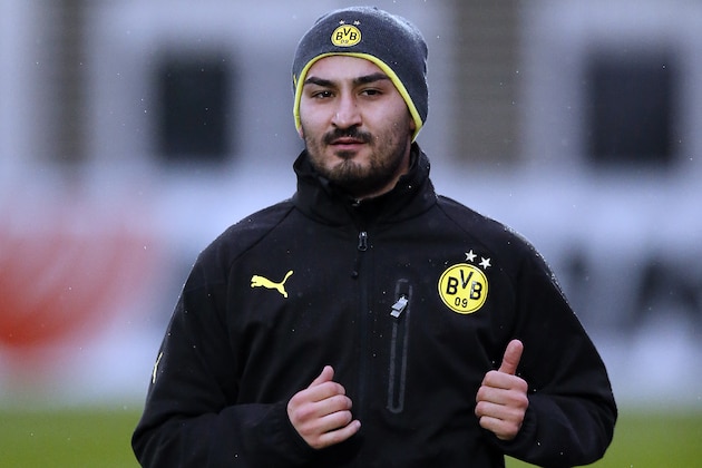 Dortmund's Ilkay Gundogan warms up during a training session one day ahead the Champions League group F soccer match between Borussia Dortmund and Arsenal FC in Dortmund, Germany, Tuesday, Nov. 5, 2013. (AP Photo/Frank Augstein)
